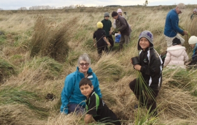 Helping hands: Wetland plant day, Diane Buckley and two pupils from Martinborough Primary School pitch in to help.