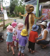 Attention getter: Children at Fox St Pre School, Ballina, get a friendly visitor to celebrate the launch of WetlandCare Australia’s Wetland Discovery Programme.